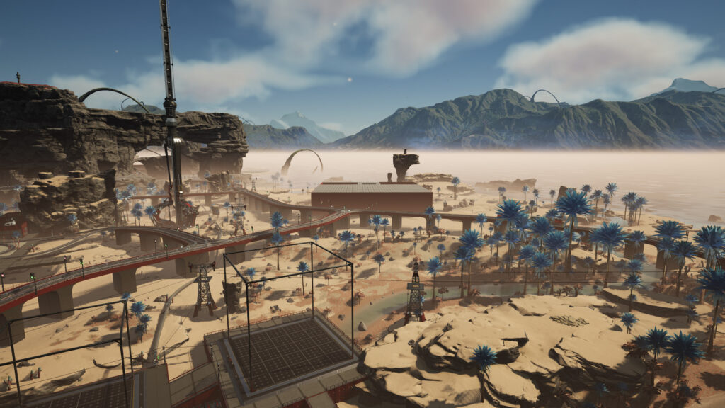 Screenshot from the game Satisfactory. The desert landscape with rail bridges running across it, and a large warehouse-style building in the background.