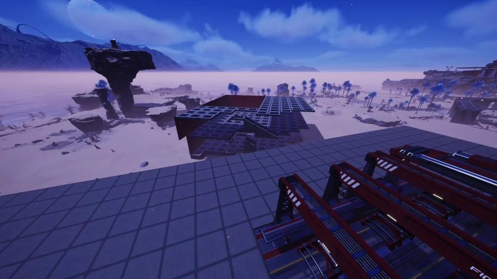 Screenshot from the game Satisfactory. In the foreground there is a train station, in the main area of the screenshot is a half-dismantled building in the desert.